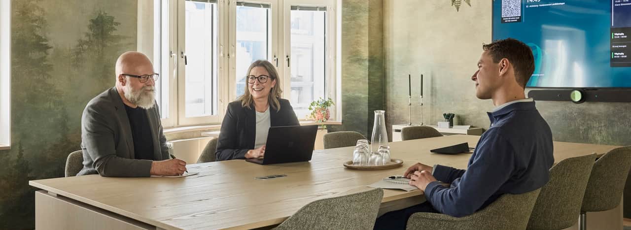 People talking in a conference room.
