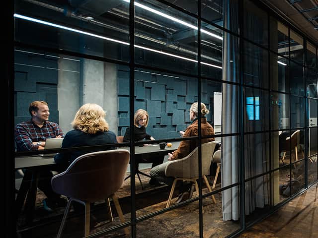 People sitting in a conference room.