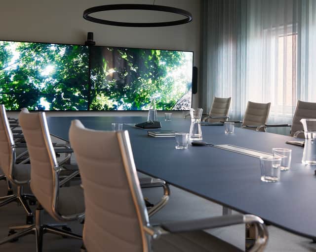Conference room with a screen on the wall.